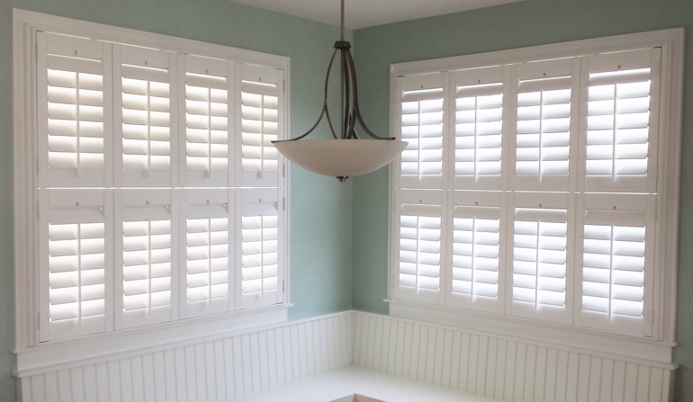 Soft green wall in Hartford kitchen with shutters.